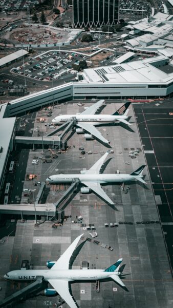 white and gray airplane on airport during daytime